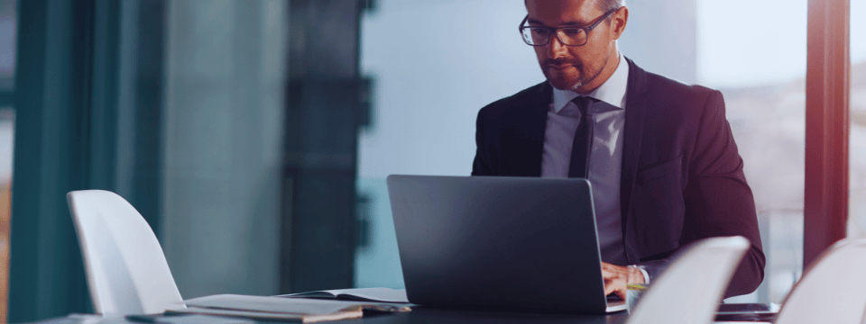 Computer, working and business man in office or conference room schedule, agenda and management software. Typing, career research and workflow plannin